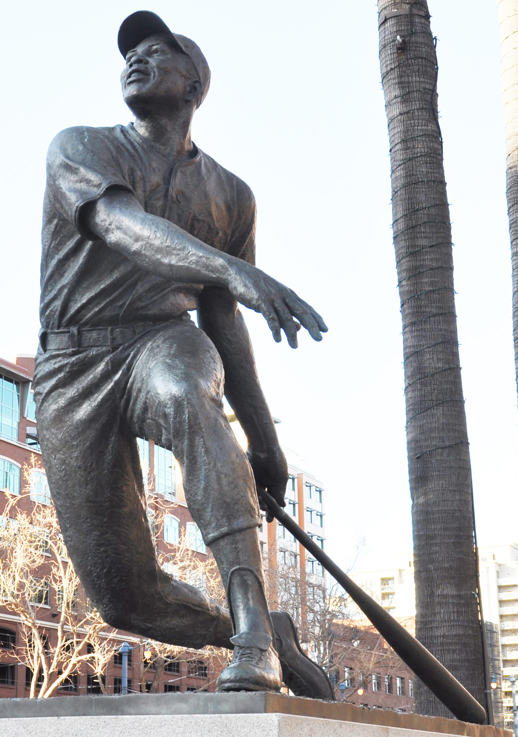 The Willie Mays statue in front of a boarded up Oracle Park during